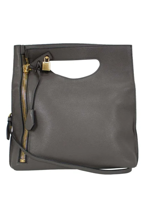 Grey leather handbag with detachable shoulder strap and large gold zipper detail