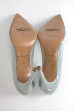 Grey patent leather high heeled pumps.