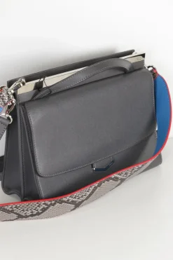 Grey pebbled leather bag with front flap, magnetic clasp and short top handle.
