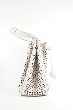 Grey perforated leather top handle bag. Drawstring closure. Bag comes with detachable leather zip pouch