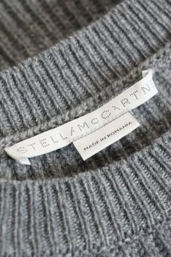 Grey, ribbed, long-sleeved, shoulder less, cropped cashmere sweater with lace up detailing on the shoulders
