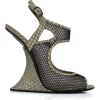Grey snake skin wedge sandals with black mesh details and curved heels.