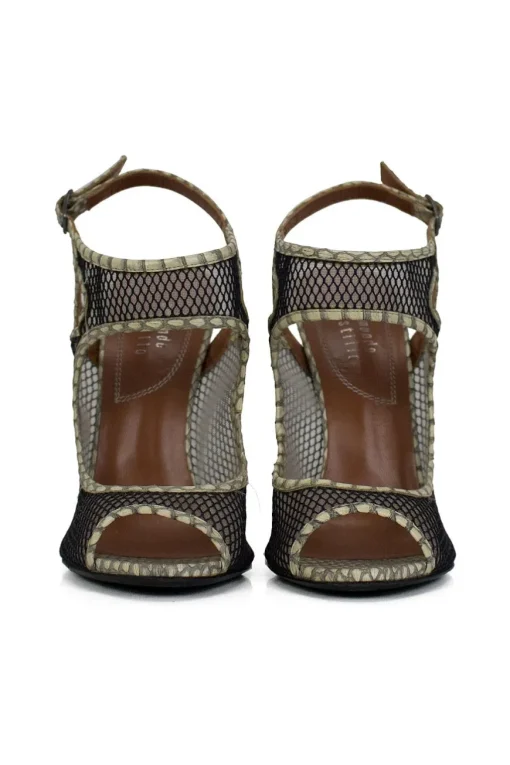 Grey snake skin wedge sandals with black mesh details and curved heels.