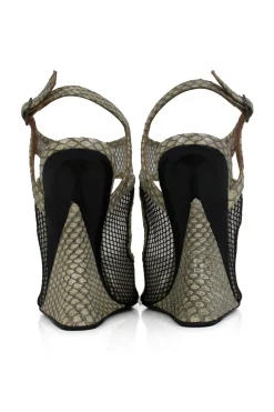 Grey snake skin wedge sandals with black mesh details and curved heels.