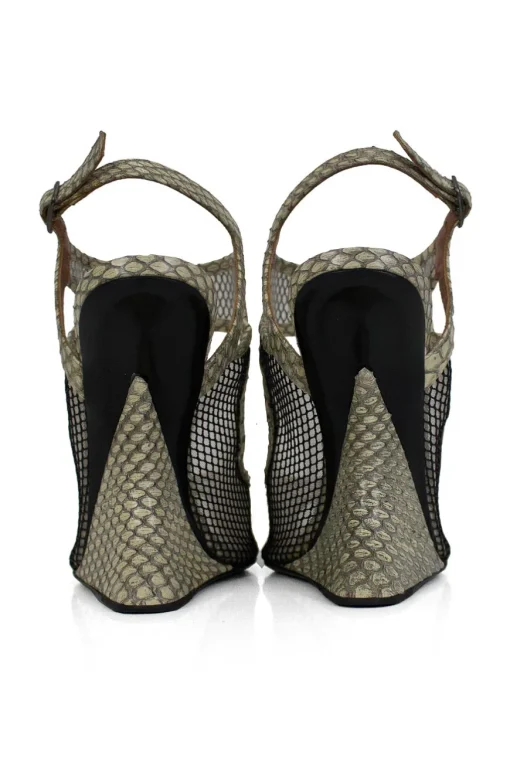 Grey snake skin wedge sandals with black mesh details and curved heels.