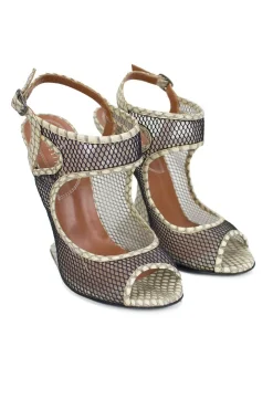 Grey snake skin wedge sandals with black mesh details and curved heels.