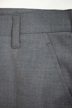 Grey tapered dress pants with white lace cuffed hem