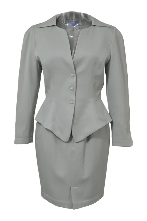 Grey wool two-piece skirt suit featuring spread collar sculpted jacket and slit-front pencil skirt