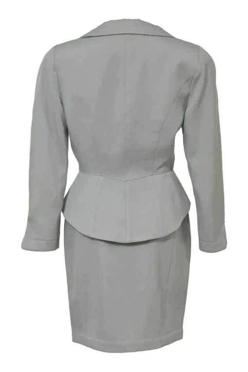 Grey wool two-piece skirt suit featuring spread collar sculpted jacket and slit-front pencil skirt