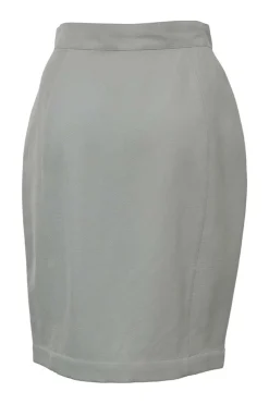 Grey wool two-piece skirt suit featuring spread collar sculpted jacket and slit-front pencil skirt
