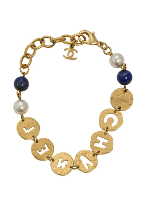 Hammered gold-tone metal, enamel, and resin cutout logo charm bracelet with lobster-clasp closure