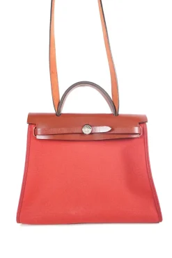 Herbag Zip 31 backpack in burgundy leather top flap and red canvas
