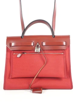 Herbag Zip 31 backpack in burgundy leather top flap and red canvas