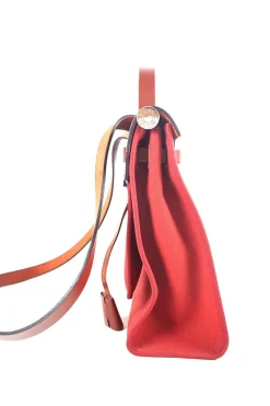 Herbag Zip 31 backpack in burgundy leather top flap and red canvas