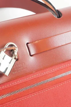 Herbag Zip 31 backpack in burgundy leather top flap and red canvas