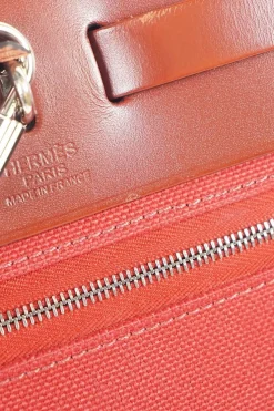 Herbag Zip 31 backpack in burgundy leather top flap and red canvas