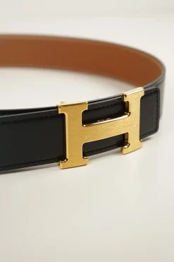 Hermes gold tone H buckle with belt in black leather and brown on reverse
