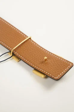 Hermes gold tone H buckle with belt in black leather and brown on reverse