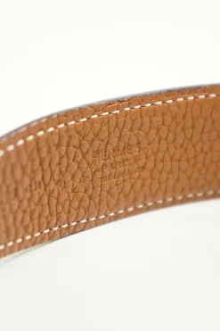 Hermes gold tone H buckle with belt in black leather and brown on reverse