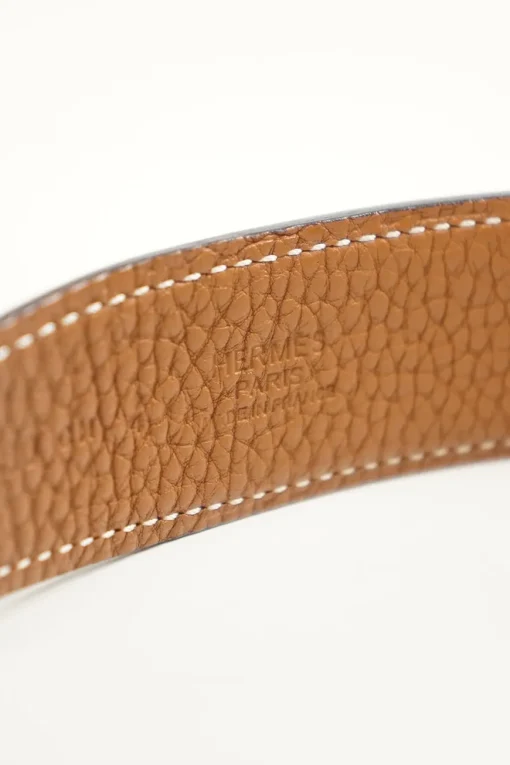 Hermes gold tone H buckle with belt in black leather and brown on reverse