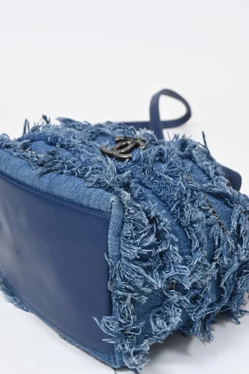 Indigo lambskin leather and fringed cotton denim crossbody bucket bag with silver-tone hardware