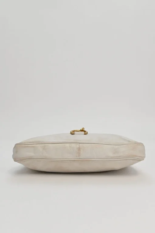Ivory aged leather snap hook shoulder bag with gold-tone metallic hardware