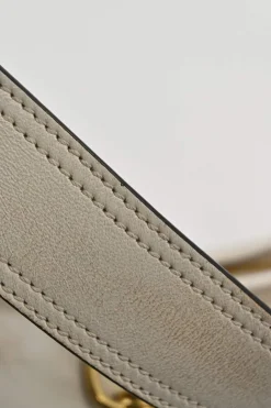 Ivory aged leather snap hook shoulder bag with gold-tone metallic hardware