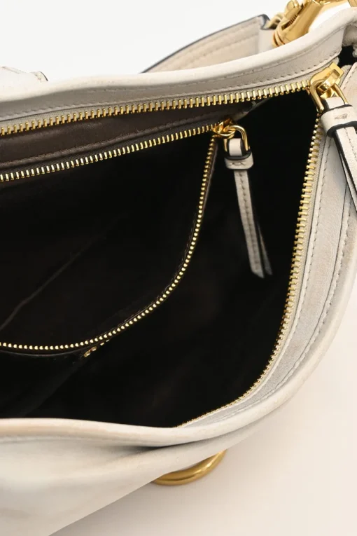 Ivory aged leather snap hook shoulder bag with gold-tone metallic hardware