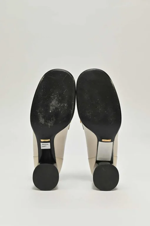 Ivory and black grained calfskin square-toe block heel chain detail loafers