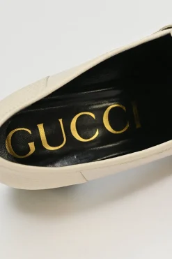 Ivory and black grained calfskin square-toe block heel chain detail loafers