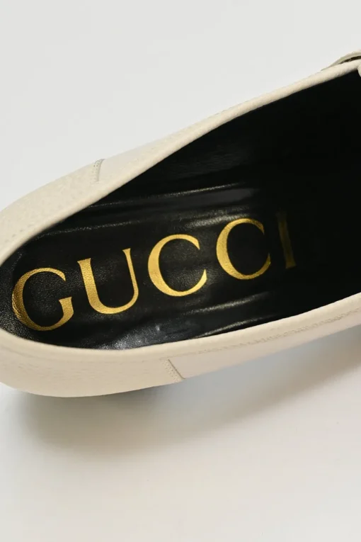 Ivory and black grained calfskin square-toe block heel chain detail loafers
