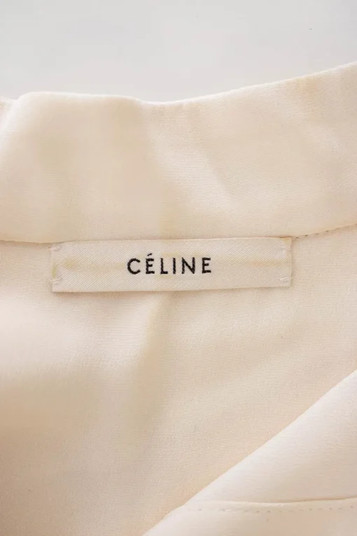Ivory and black wool drop waist band collar button down blouse and tuxedo trouser paneled jumpsuit