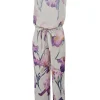 Ivory and purple silk painterly floral print roll neck jumpsuit with drawstring waist and tonal lace inserts