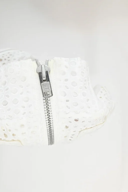 Ivory cotton broderie Anglaise peek-a-book zip-up bomber jacket with ribbed collar, cuffs, and hem