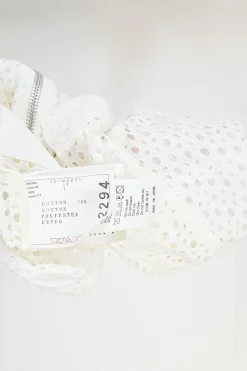 Ivory cotton broderie Anglaise peek-a-book zip-up bomber jacket with ribbed collar, cuffs, and hem