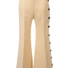 Ivory flared tailored trousers with side seam button fastening