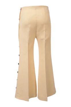 Ivory flared tailored trousers with side seam button fastening