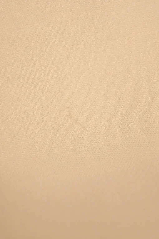 Ivory flared tailored trousers with side seam button fastening