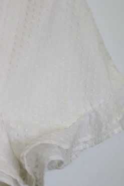 Ivory lattice-embroidered polyester high-rise mini ruffle shorts