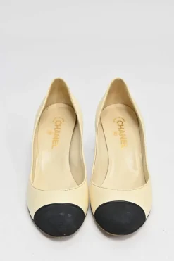 Ivory leather and grosgrain round-toe mid-heel pumps with contrast cap toe