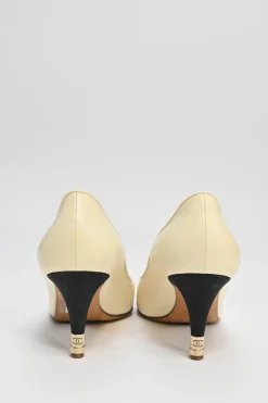Ivory leather and grosgrain round-toe mid-heel pumps with contrast cap toe