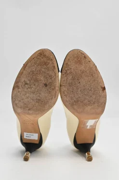 Ivory leather and grosgrain round-toe mid-heel pumps with contrast cap toe