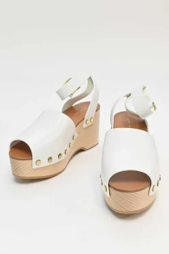 Ivory leather and wood studded platform clog sandals with buckle strap fastening