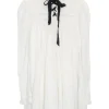 Ivory polyamide-blend fully-fashioned lace-up funnel neck empire waist tunic top with tiered puff sleeves