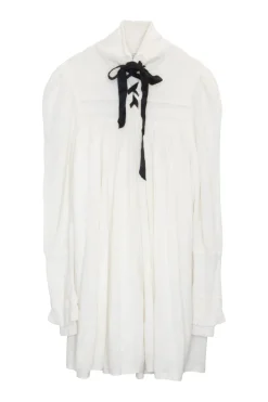 Ivory polyamide-blend fully-fashioned lace-up funnel neck empire waist tunic top with tiered puff sleeves