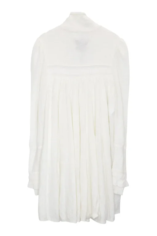 Ivory polyamide-blend fully-fashioned lace-up funnel neck empire waist tunic top with tiered puff sleeves