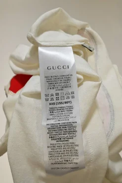 Ivory screen-printed cotton jersey crewneck pullover T-shirt featuring GG apple motif at centre front