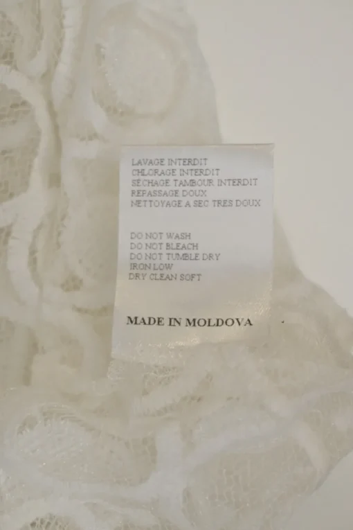 Ivory semi-sheer polyester guipure lace peek-a-boo oversized T-shirt and knee-length skirt set