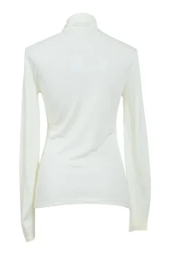 Ivory semi-sheer wool interlock jersey funnel collar pullover long sleeve top with coat of arms shoulder line shank button appliqué