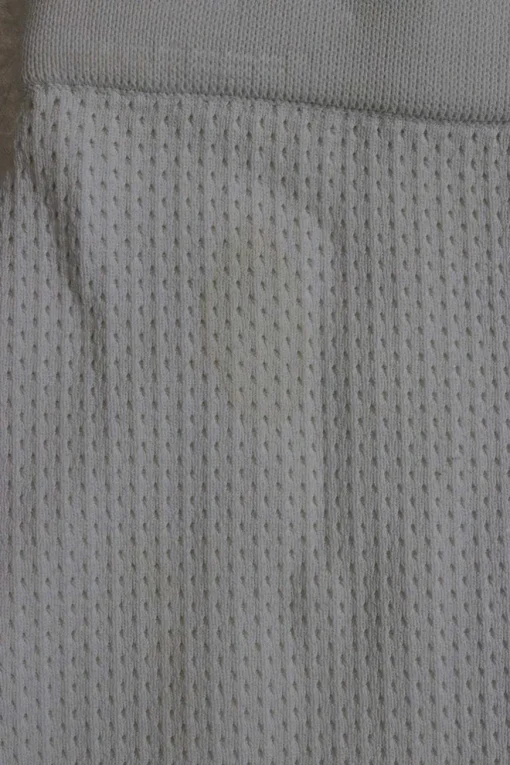 Ivory viscose-blend fully-fashioned pull-on pointelle mini pencil knit skirt with curved asymmetric hem